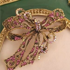 Elegant Gold and Pink Bow Brooch